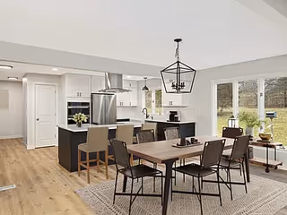 Open-concept dining area with a wooden table, chairs, and a kitchen island.