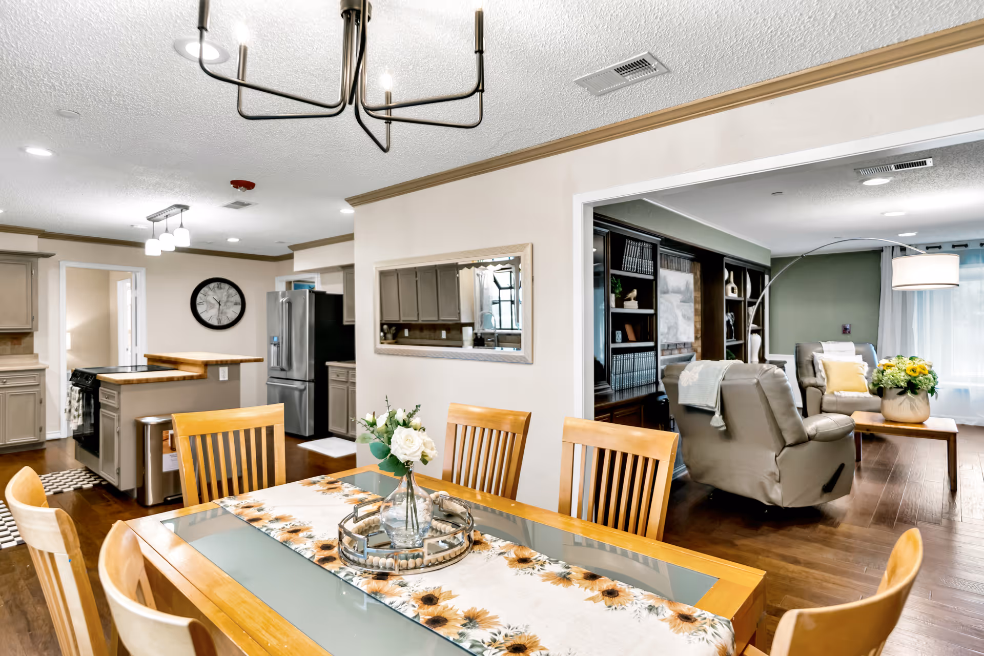 Open-concept dining area with kitchen and cozy living space.