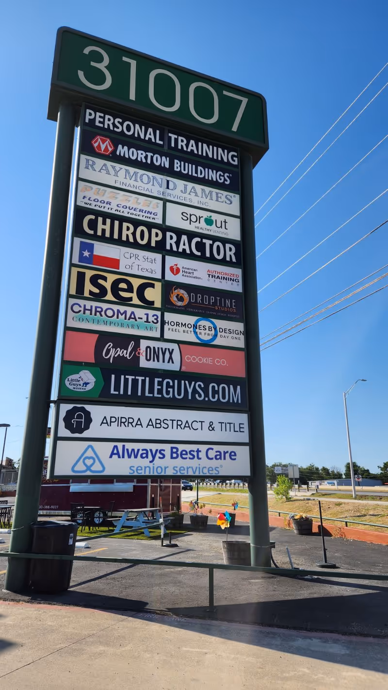 Tall outdoor signboard listing businesses, including Always Best Care Senior Services.