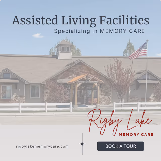 Front exterior of a senior living facility with a covered entrance and flag.