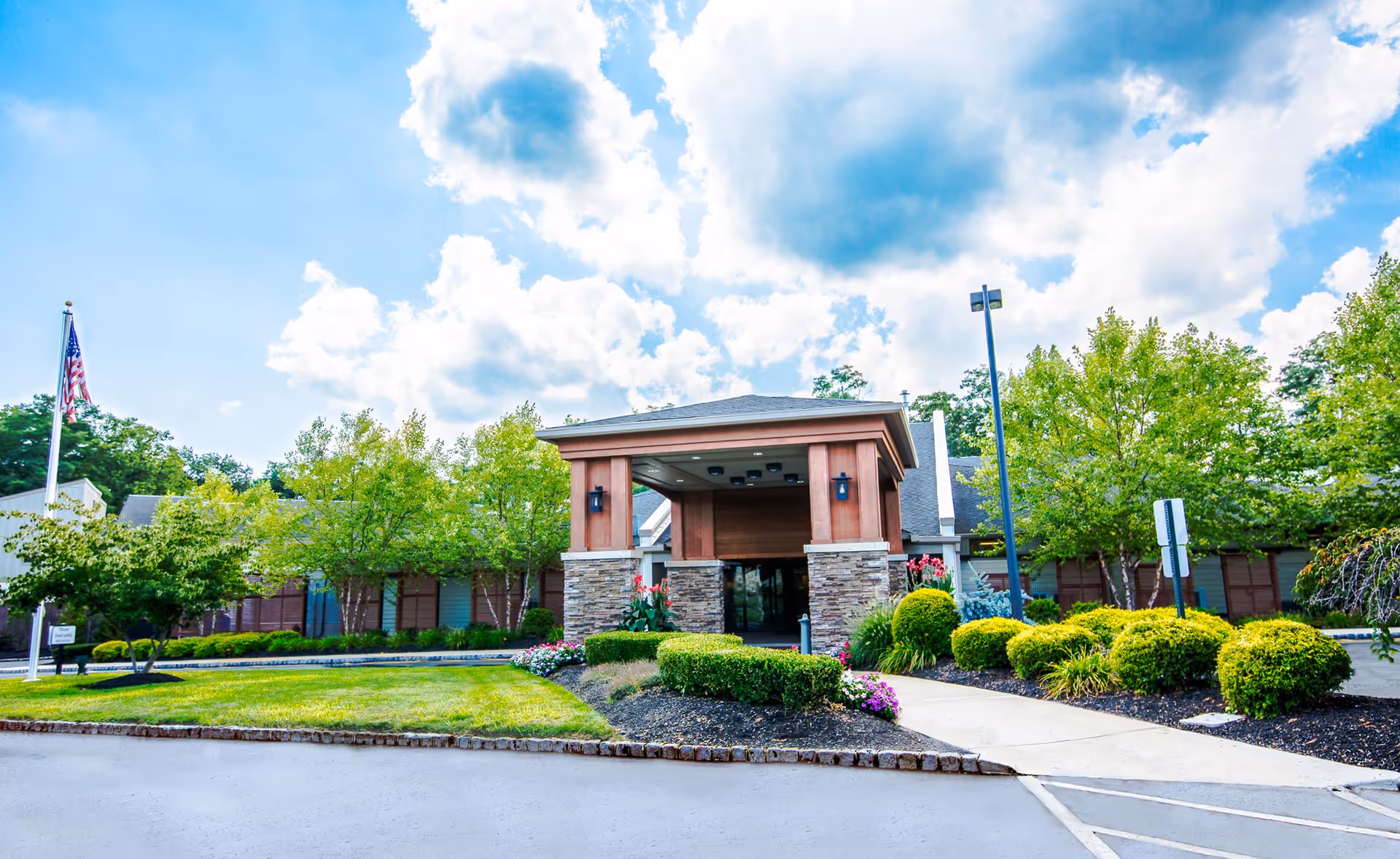 Front view of Mc Clendon Personal Care Home entrance with landscaped grounds.
