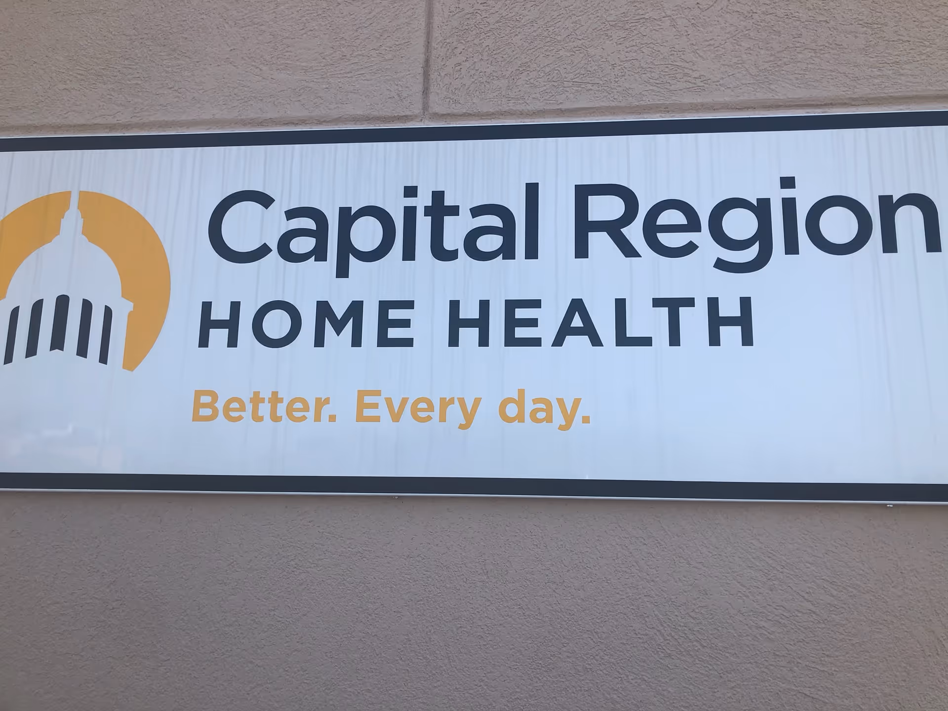 Exterior sign for Capital Region Home Health with slogan 'Better. Every day'.
