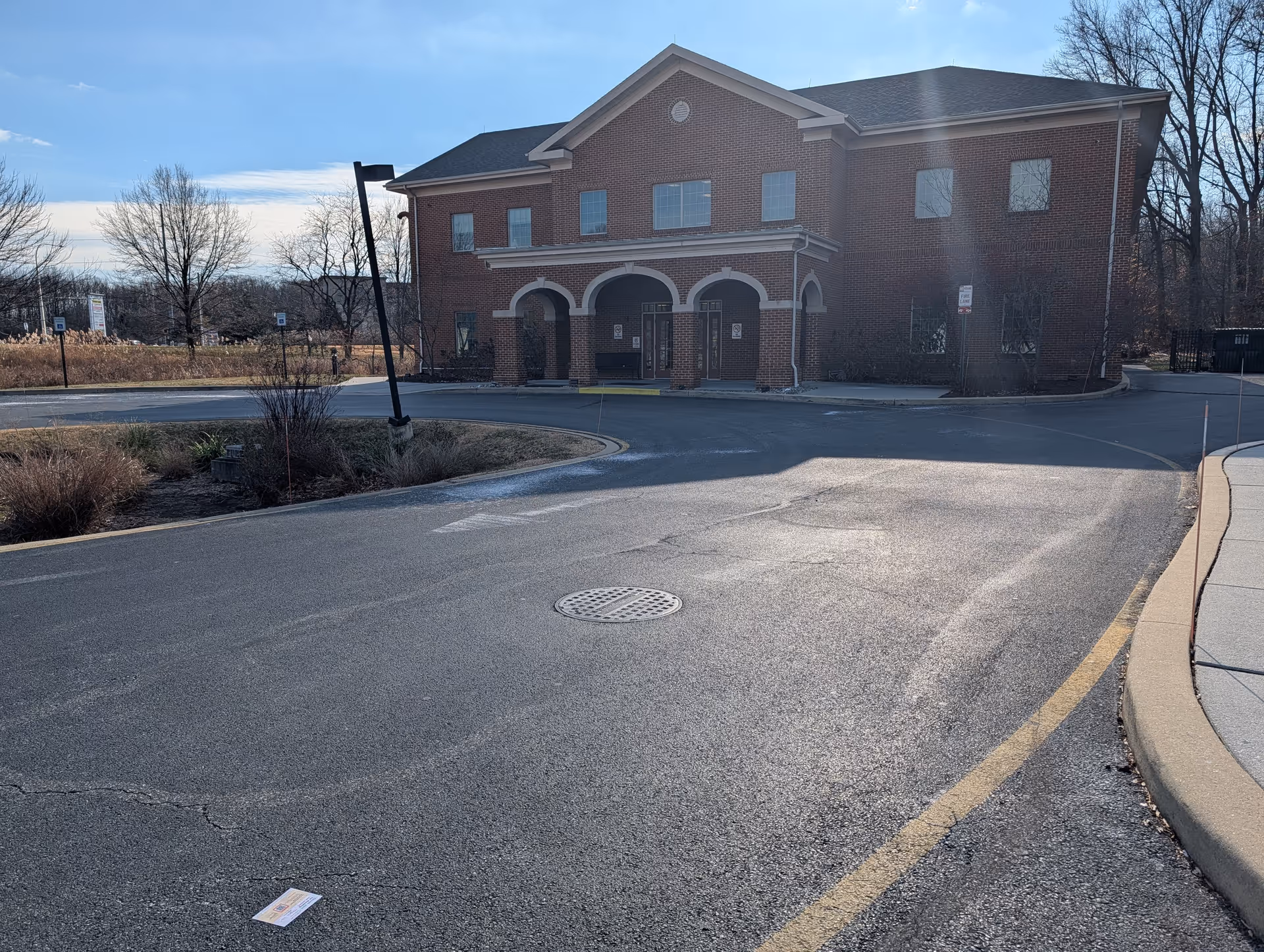 Exterior view of Wound Care Delaware facility with brick facade and arched entrance.