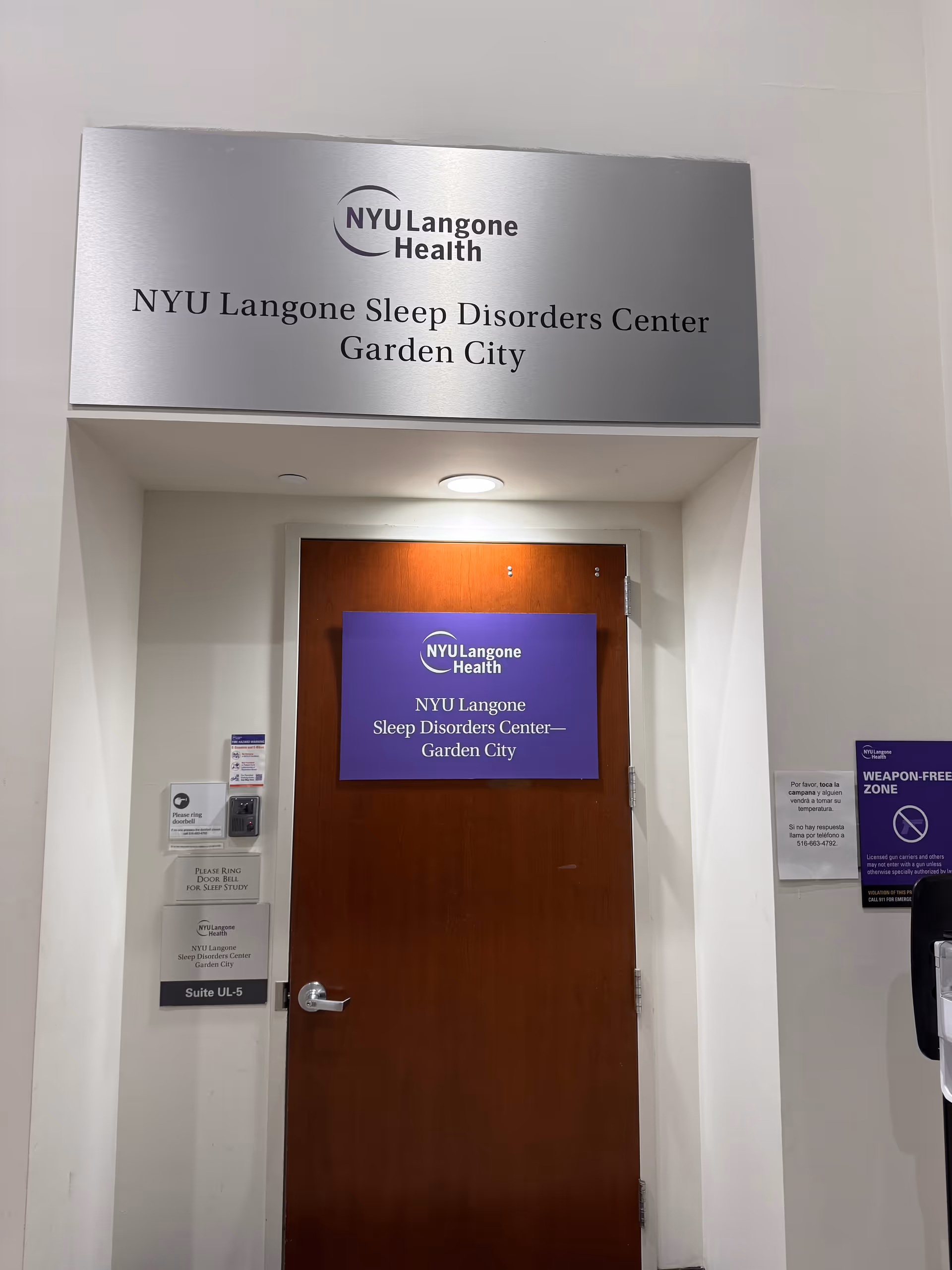 Interior doorway to NYU Langone Sleep Disorders Center Garden City with signage above.