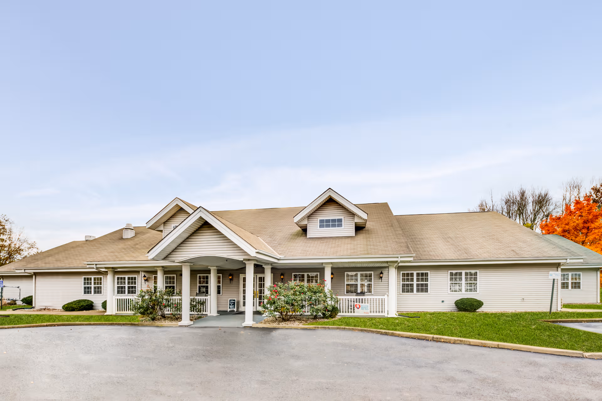Bennett Place senior living facility with a covered entrance and green lawn.