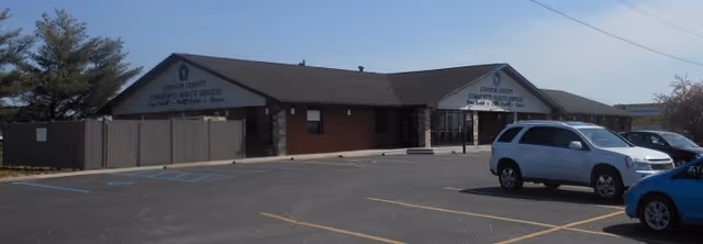 Exterior view of Johnson County Community Health Services building with parking lot