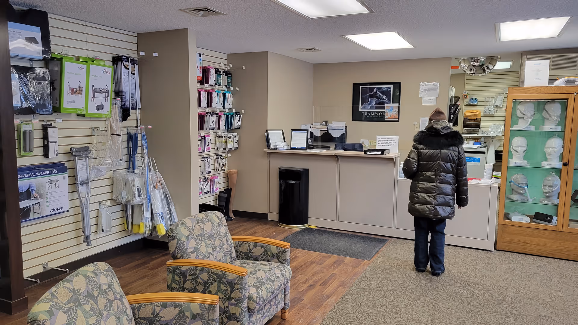Mary Greeley Home Health Services lobby with seating, a reception desk, and display shelves.