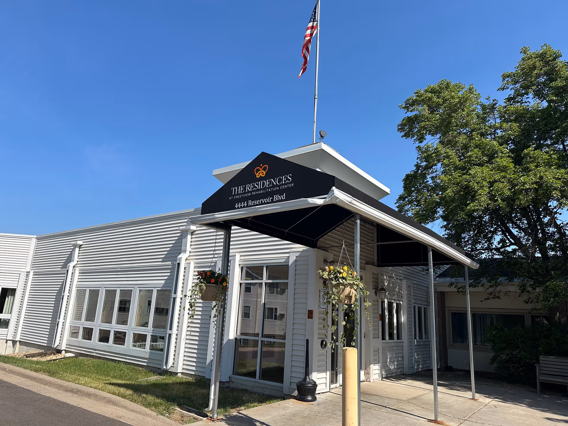 The Residences at Crestview Rehabilitation Center entrance with black canopy.