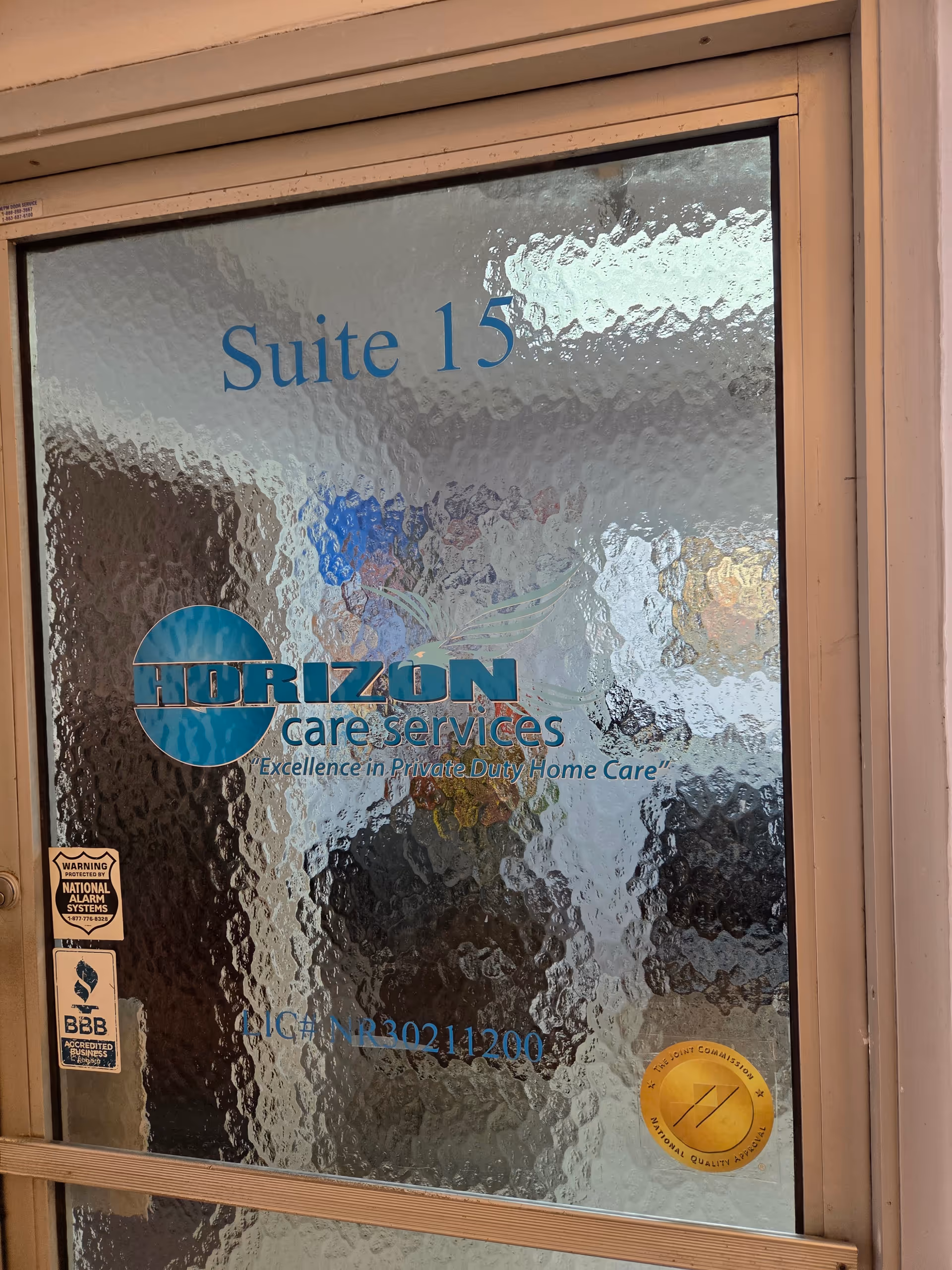 Glass door displaying Suite 15 and Horizon Care Services logo.