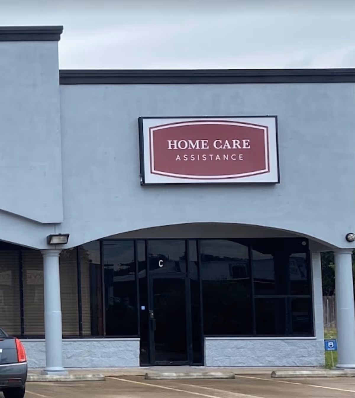 Front exterior of a Home Care Assistance building with signage above the entrance.