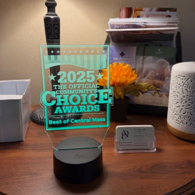 A glowing 2025 Choice Awards plaque sits on a desk at Oriol Home Health.