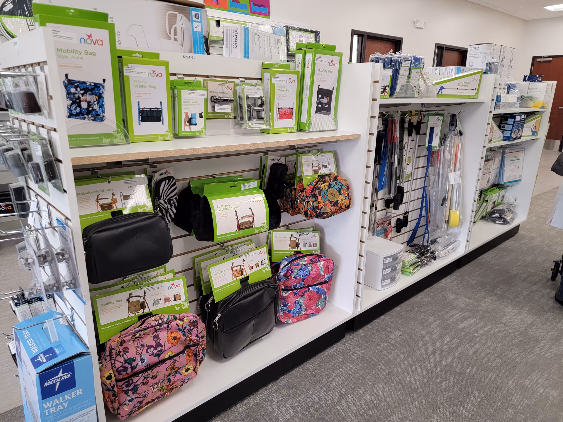 Indoor supply aisle in a health care facility displaying mobility bags and medical accessories.