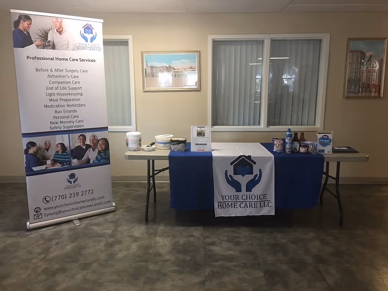 Interior lobby with Your Choice Home Care banner and information table.