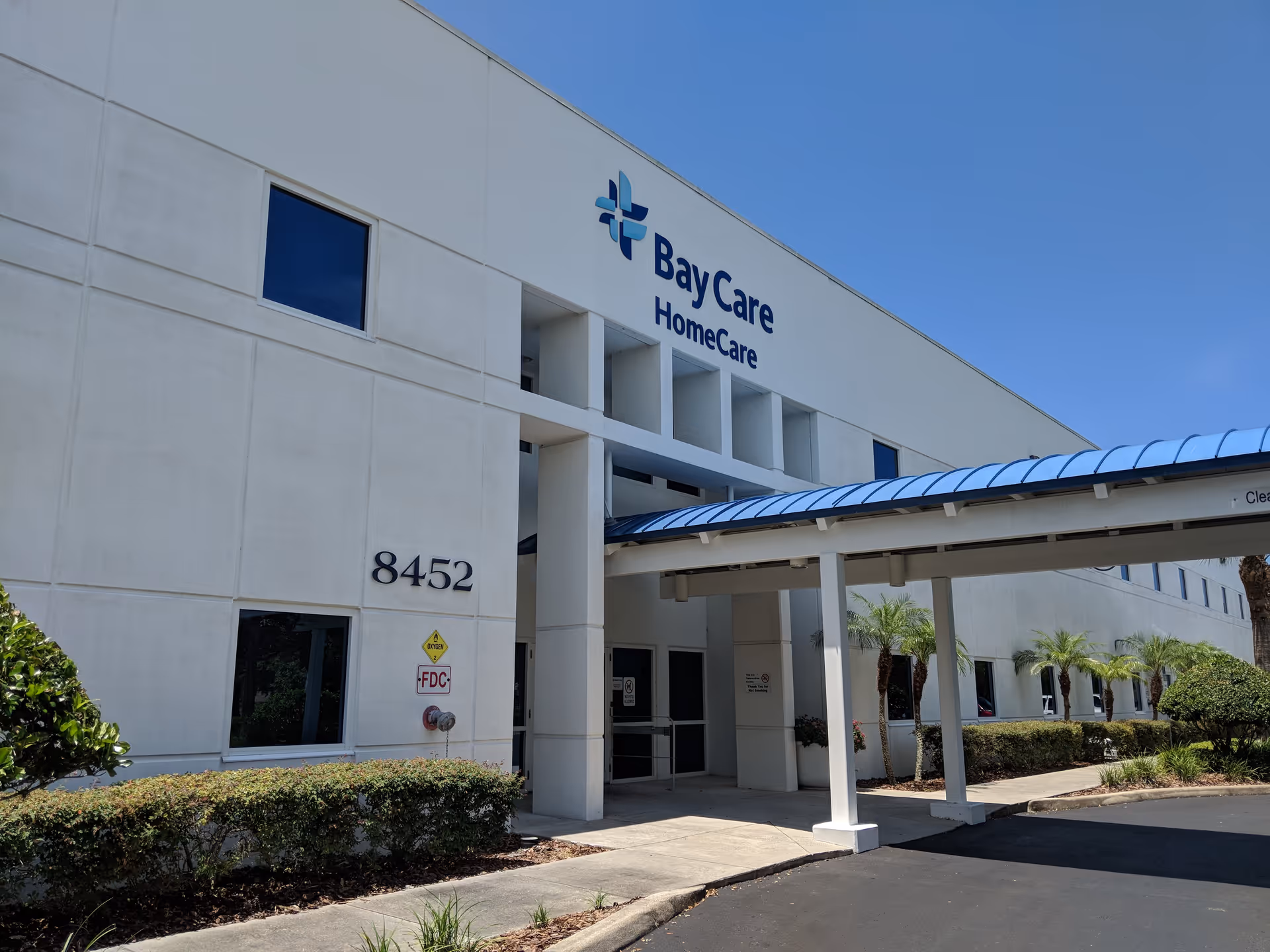 BayCare HomeCare corporate office building with a blue logo and covered entrance.