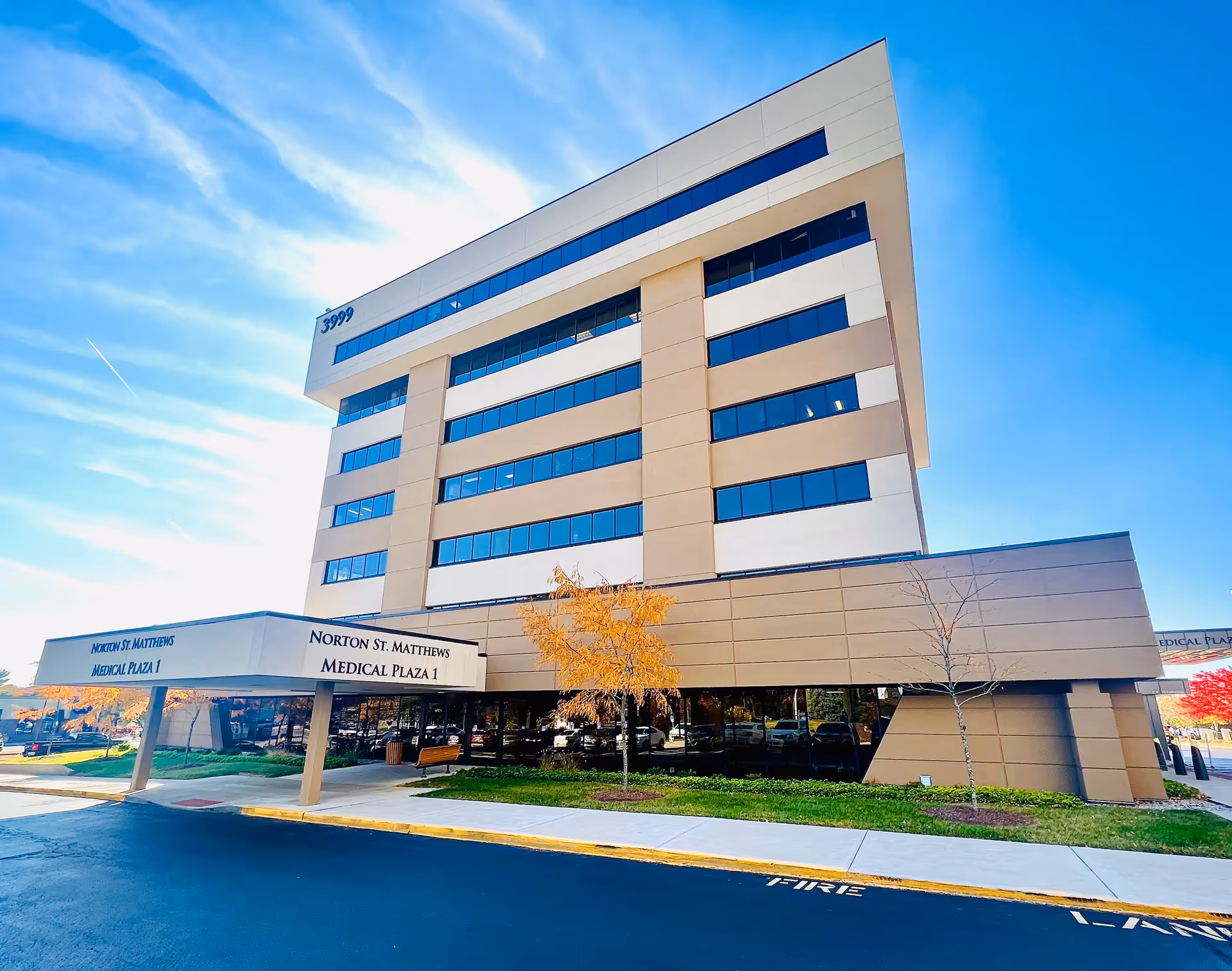 Modern, multi-story medical plaza building with Norton St. Matthews Medical Plaza 1 signage.