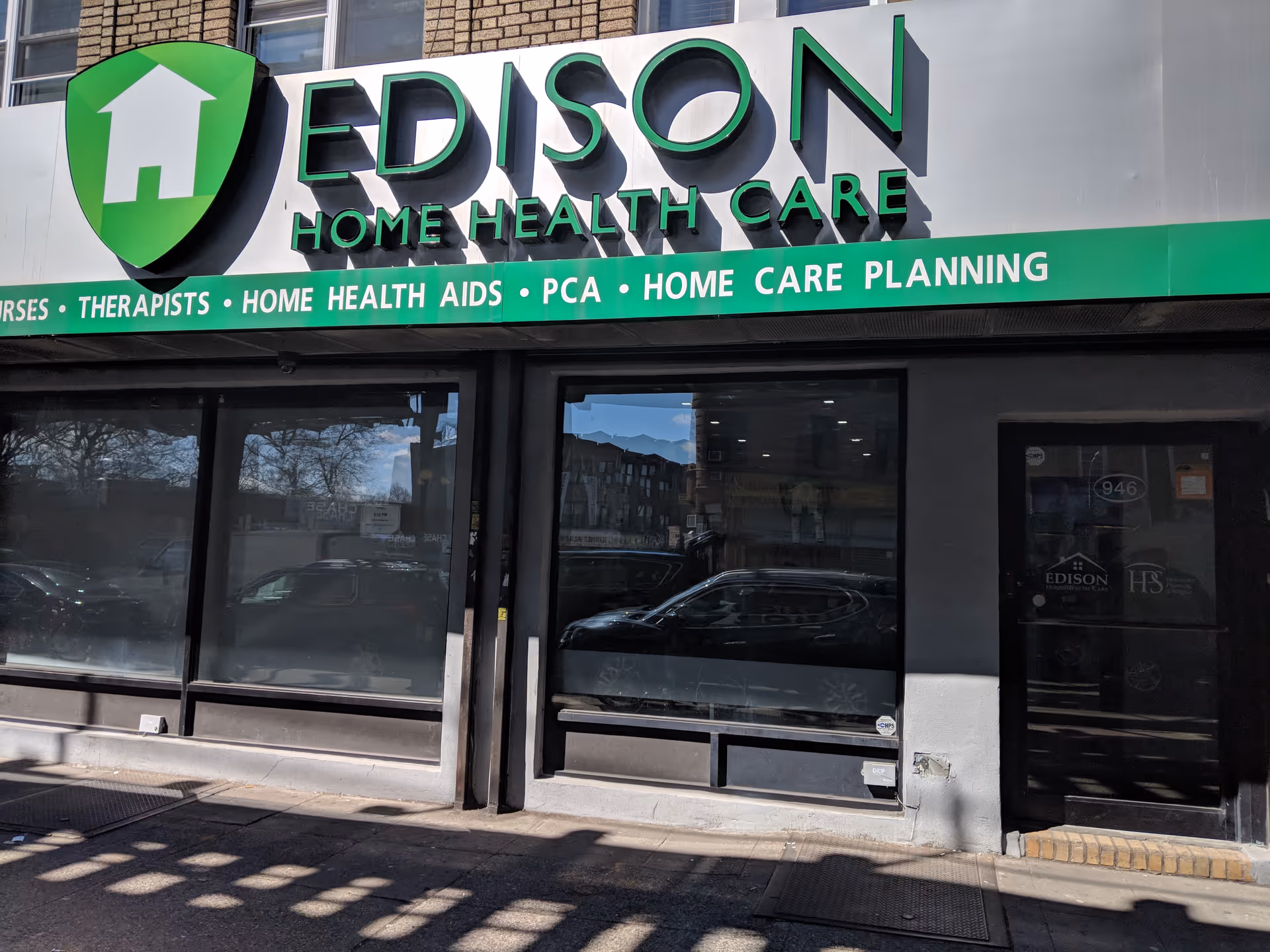 Front of Edison Home Health Care storefront with large green sign