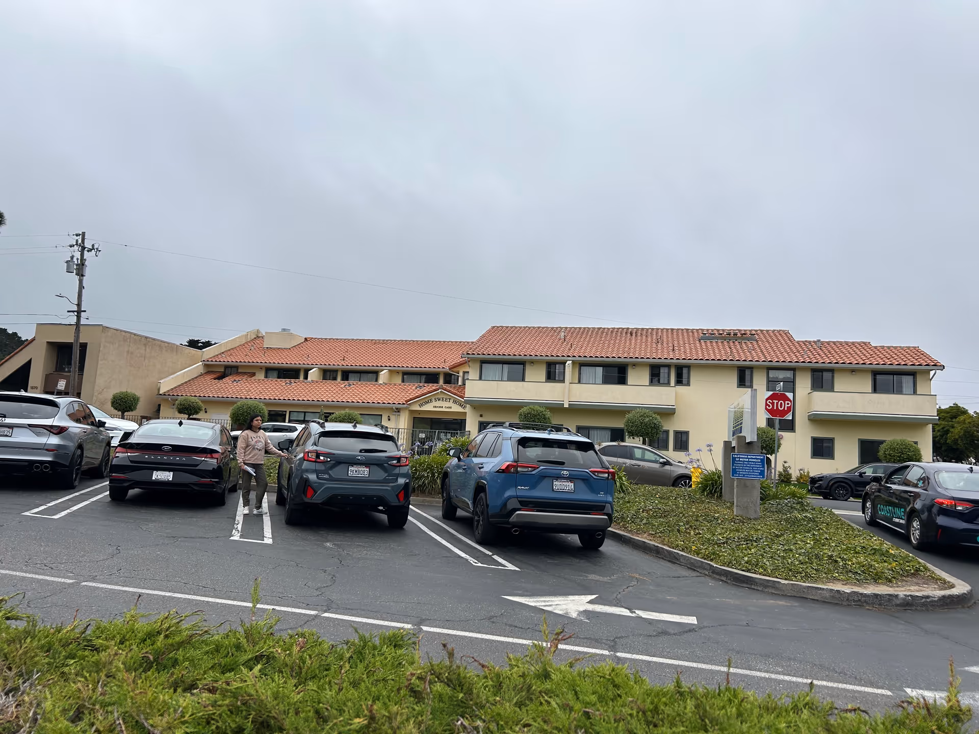 Exterior view of Home Sweet Home Senior Care building with a parking lot in foreground.