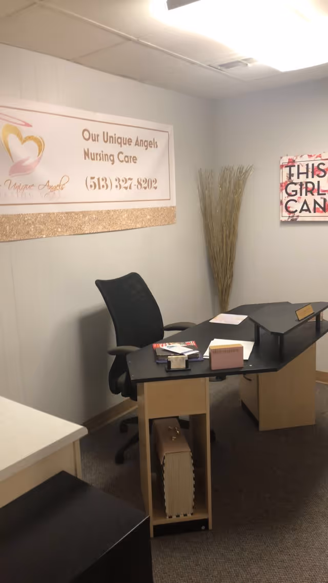 Reception desk inside Our Unique Angels Nursing Care facility with signage.