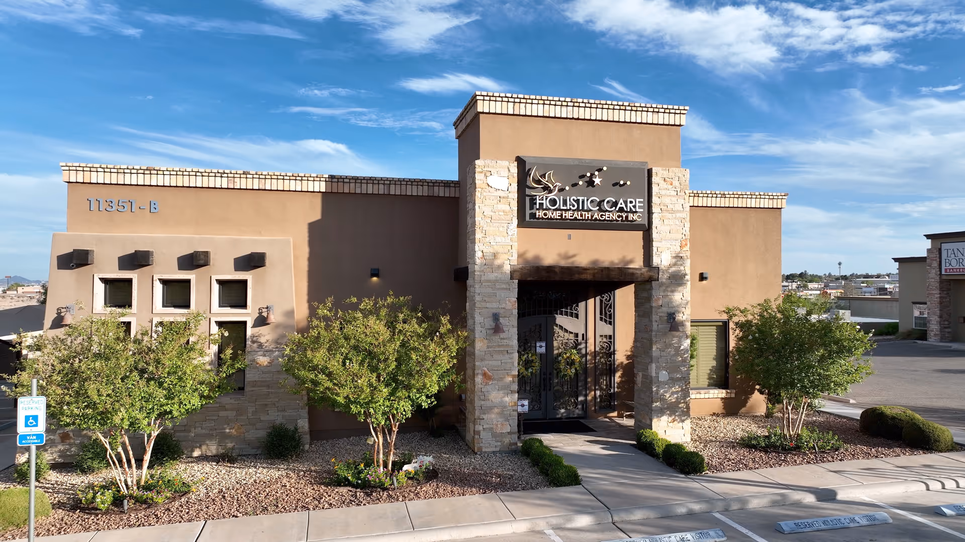 Exterior view of Holistic Care Home Health Agency building with stone entrance