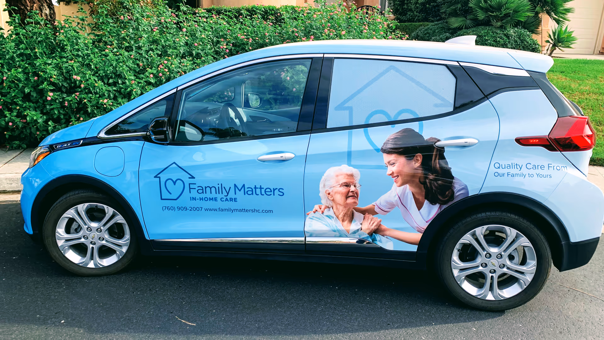 Blue promotional van with caregiver and elderly person graphics for Family Matters In-Home Care