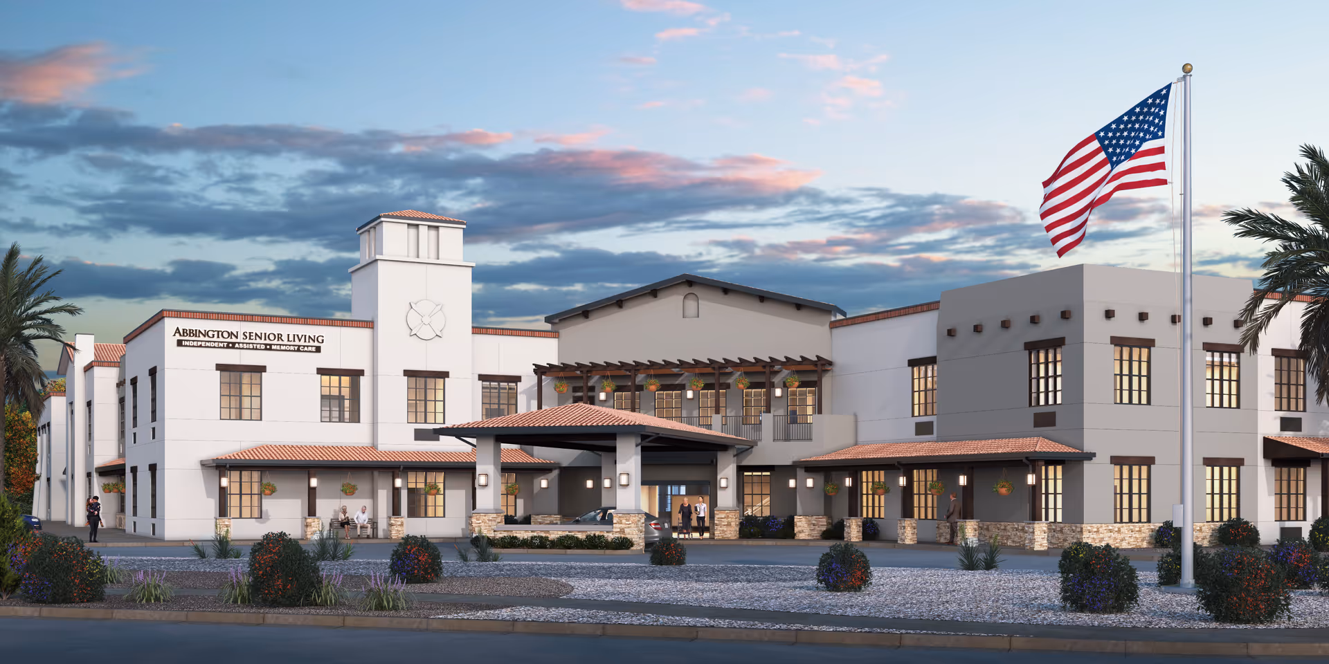 Exterior view of The Abbington Senior Living at Gilbert with American flag.