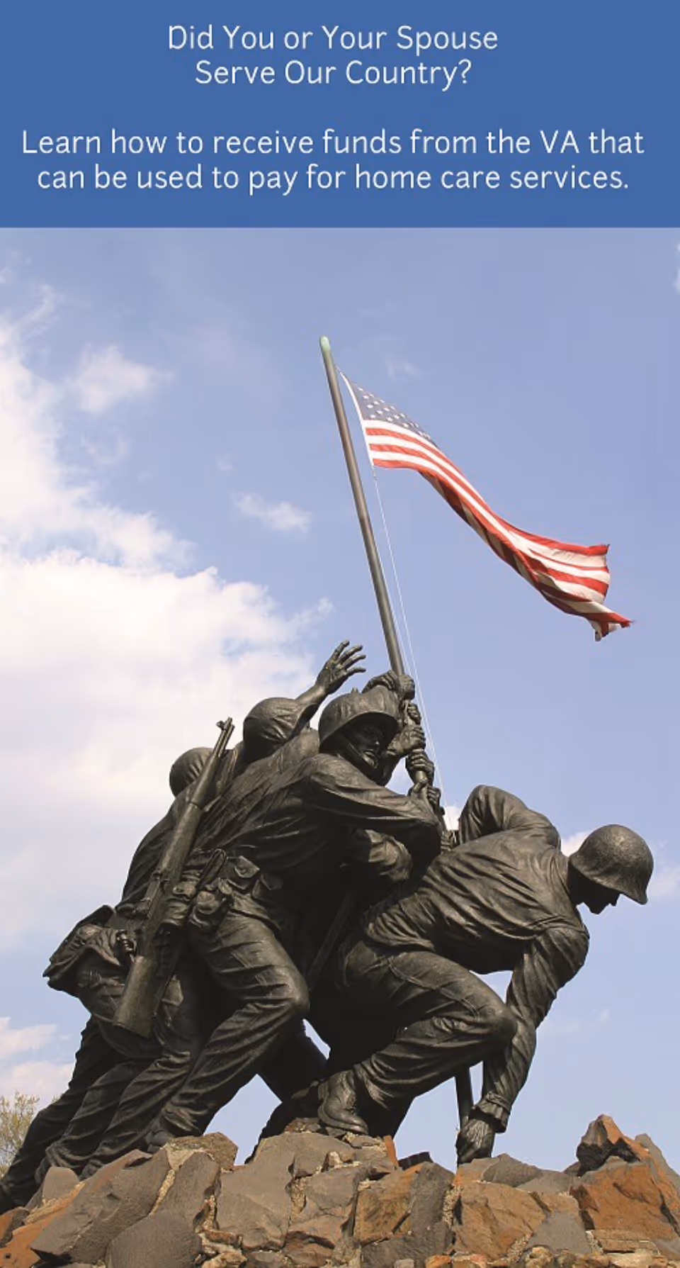 Bronze statue of soldiers raising a flag atop rocks against blue sky.