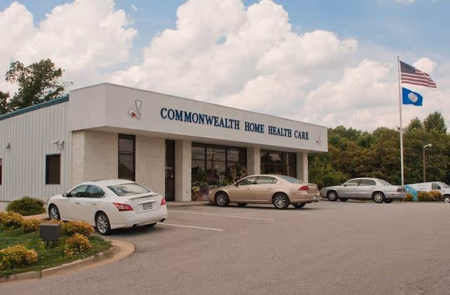 Front exterior view of Commonwealth Home Health Care building with parked cars.