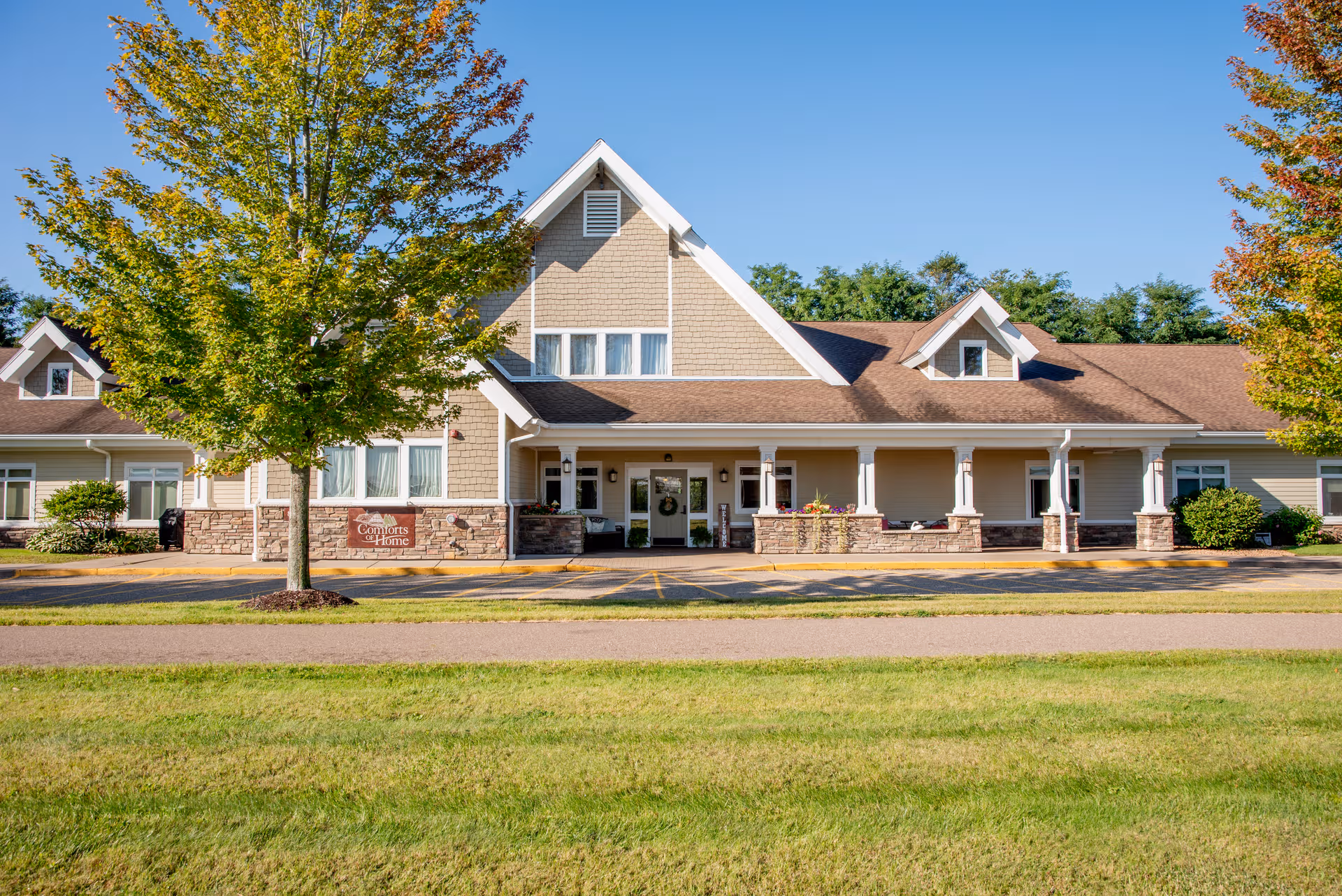Front view of Comforts of Home - The Willows senior living facility with entrance
