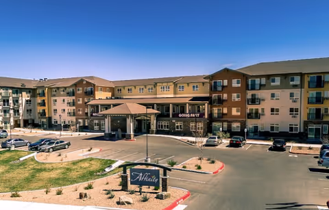 Exterior view of Affinity at Albuquerque senior living complex with a circular driveway