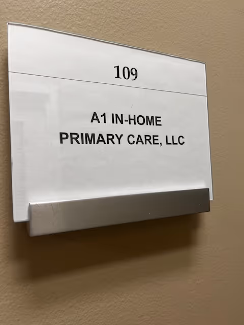 Interior wall plaque displaying room 109 and A1 In-Home Primary Care, LLC.