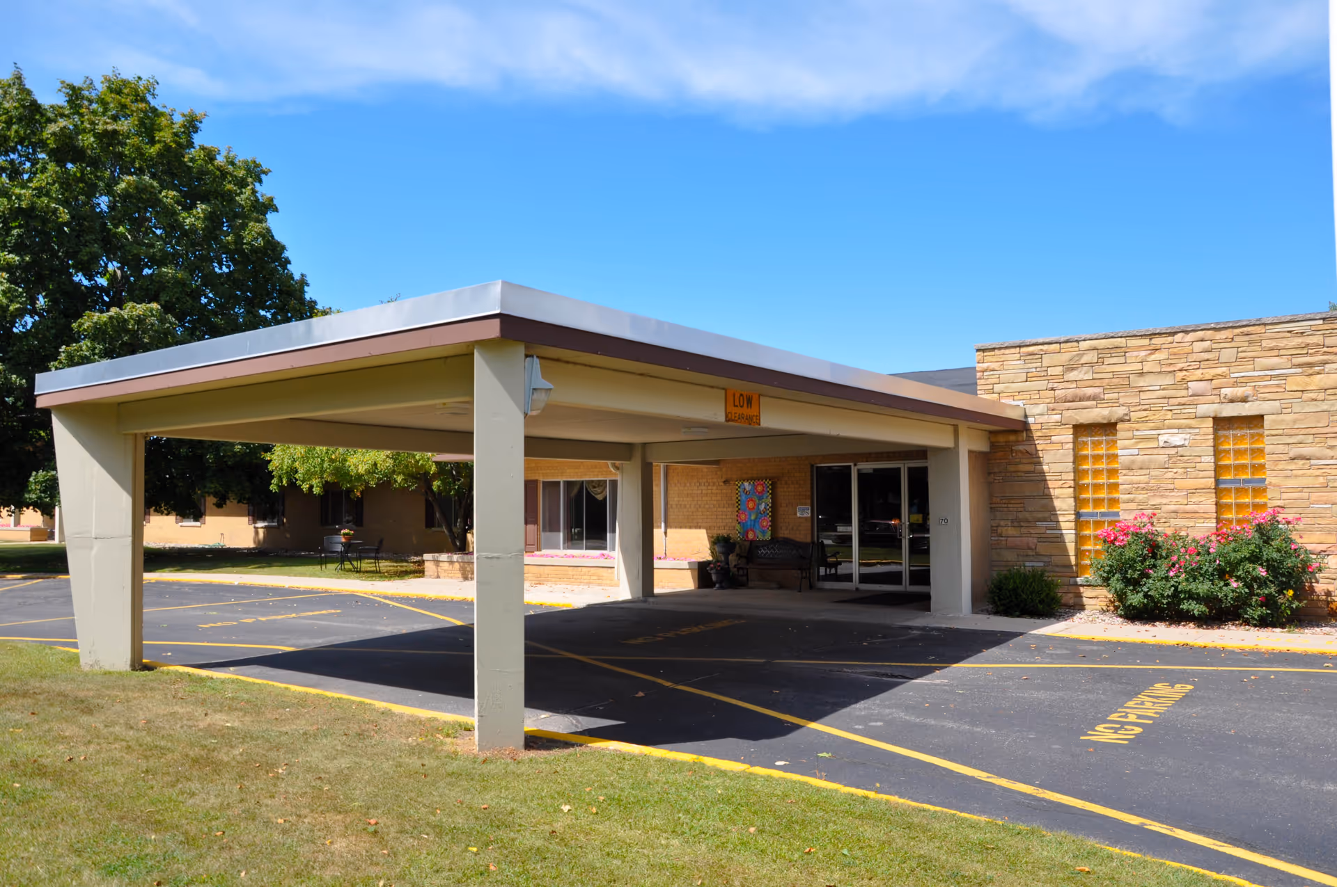 Exterior view of Greentree Health and Rehab Center entrance with a covered drive and parking.
