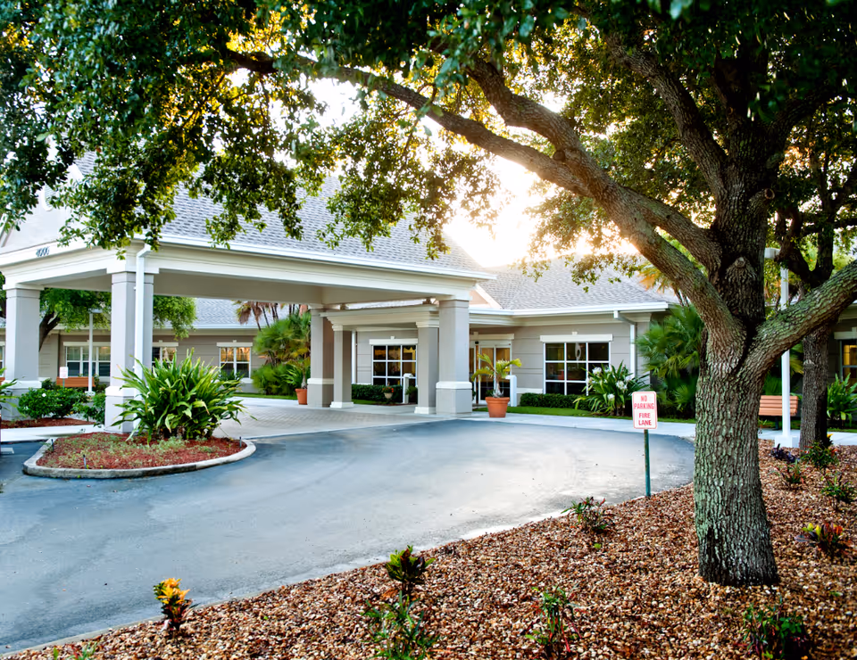 Exterior view of Solaris Healthcare Charlotte Harbor with a porte-cochère and landscaped driveway.