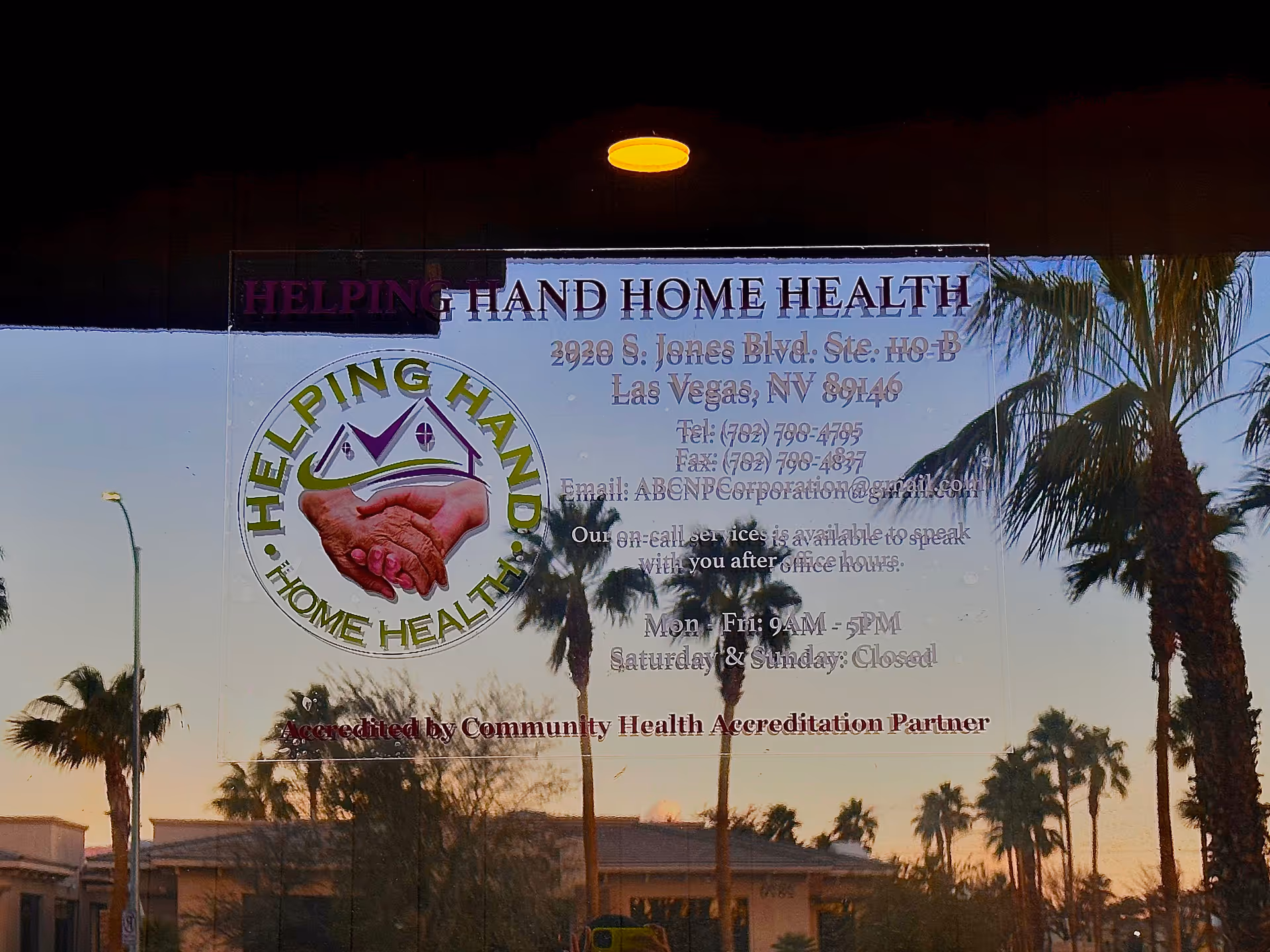 Glass storefront showing 'Helping Hand Home Health' sign with palm trees and logo.