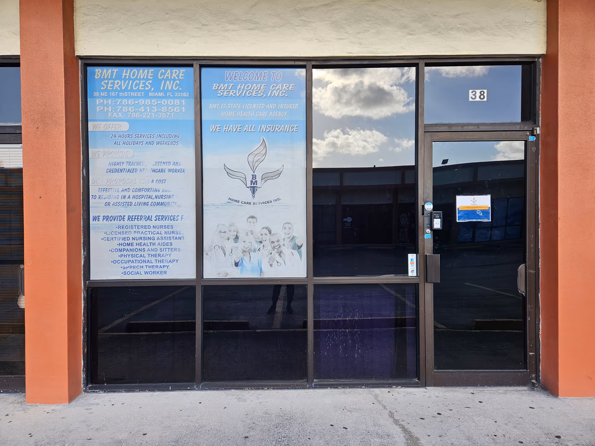 Exterior storefront of BMT Home Care Services with glass doors and signage.