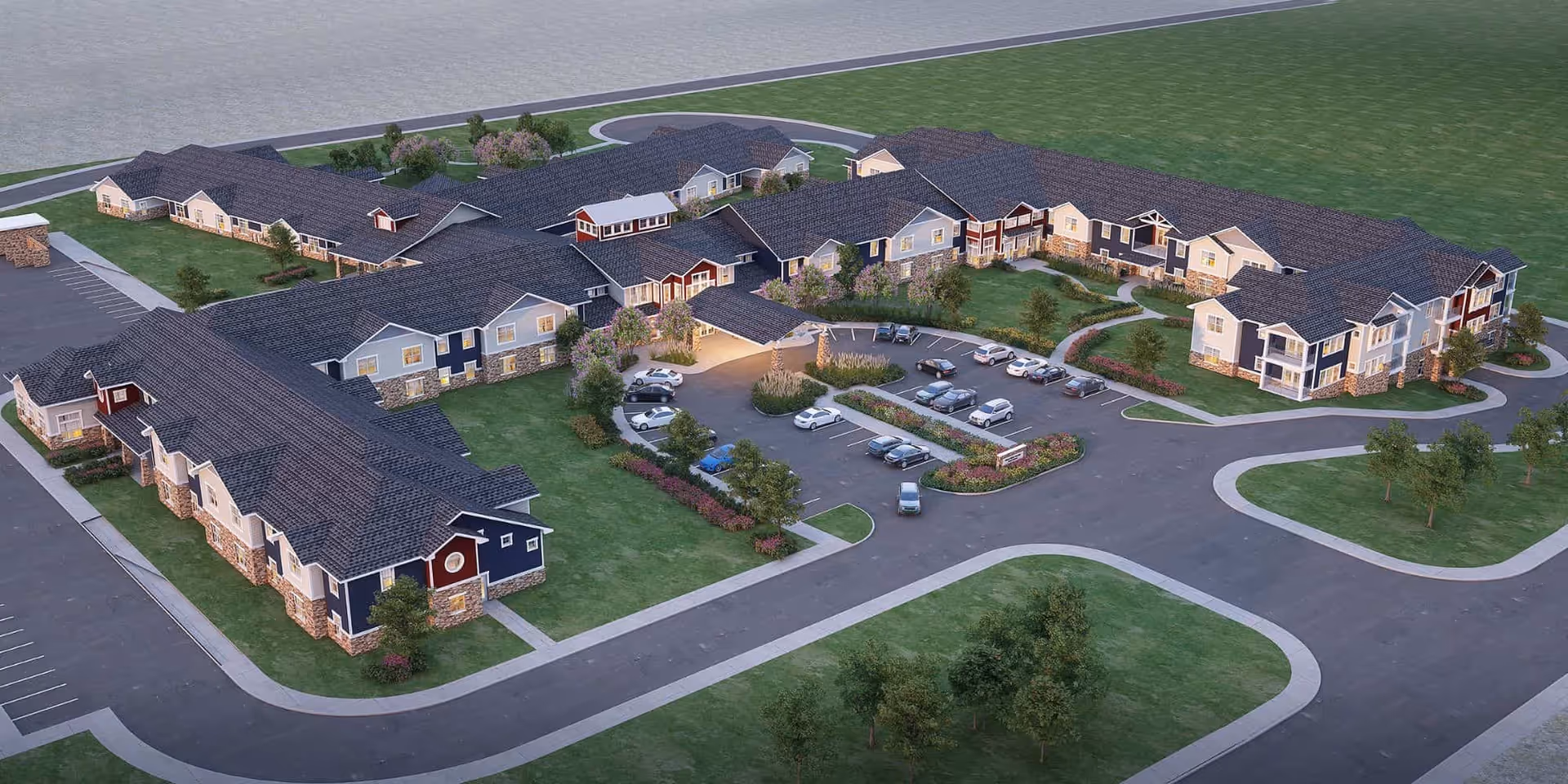 Aerial view of a large senior living campus with interconnected buildings and parking.