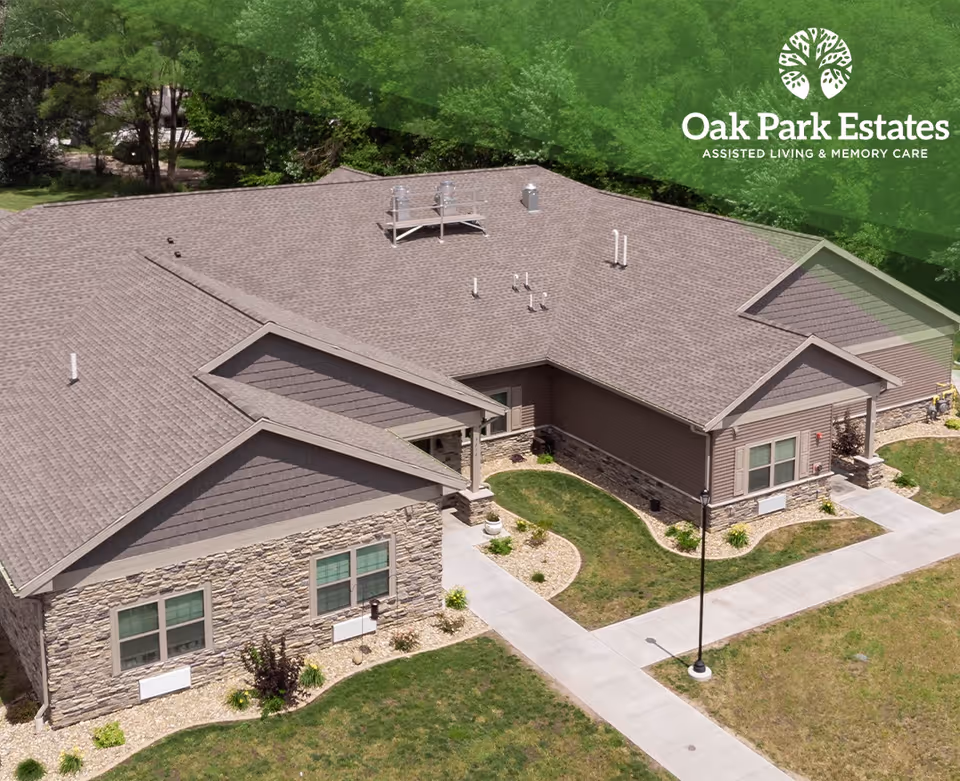 Aerial view of Oak Park Estates exterior building with landscaped grounds.