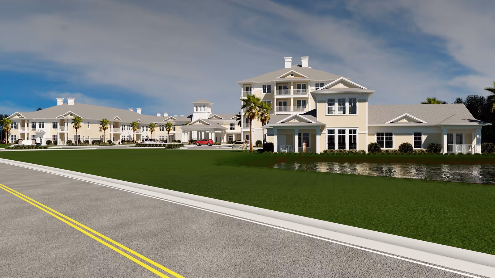 A large beige senior living campus with multiple wings beside a road and water feature.