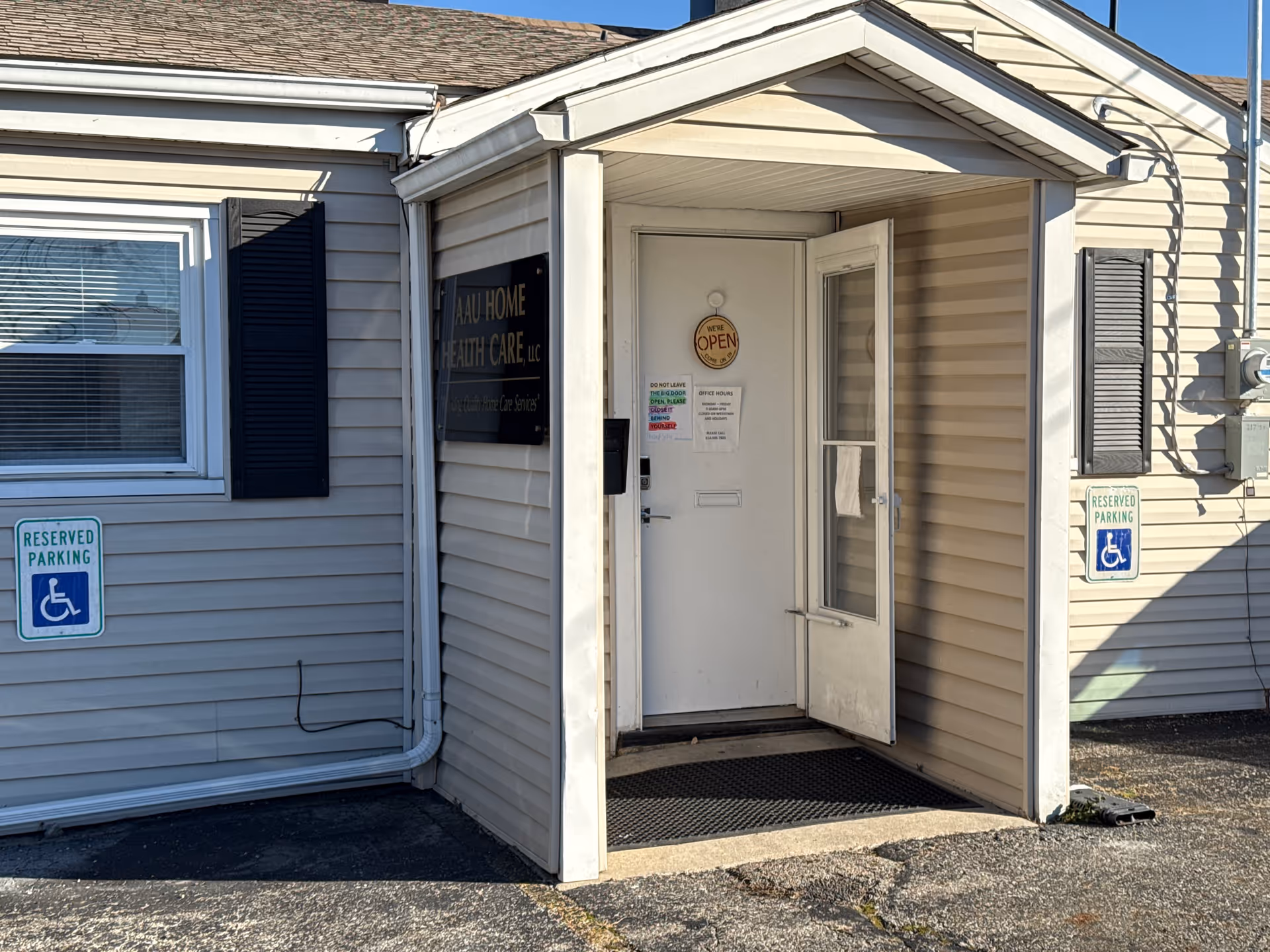 Exterior entrance of AAU Home Health Care building with open doorway
