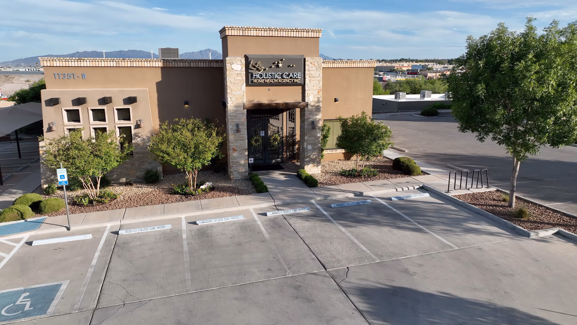 Front view of Holistic Care Home Health Agency, Inc. building with parking lot.