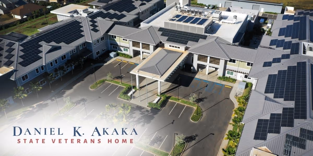 Aerial view of Daniel K. Akaka State Veterans Home exterior with solar panels and parking.