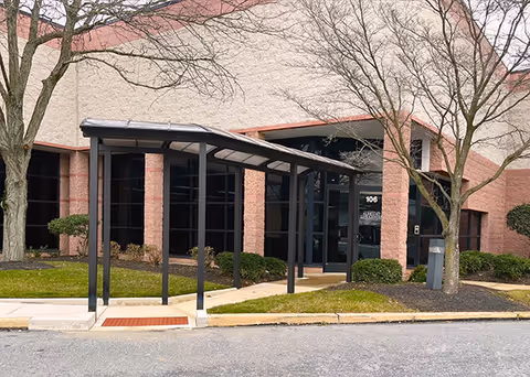 Exterior view of Albright LIFE Chester building with glass entry and covered sidewalk.
