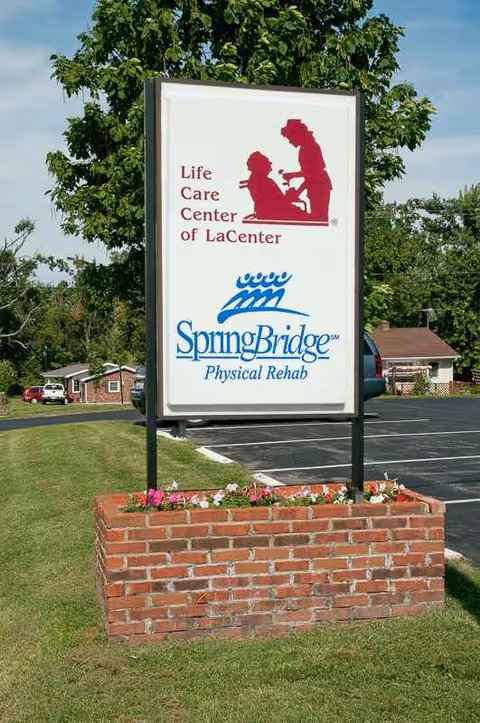 Sign at the facility entrance for Life Care Center of La Center and SpringBridge Rehab.