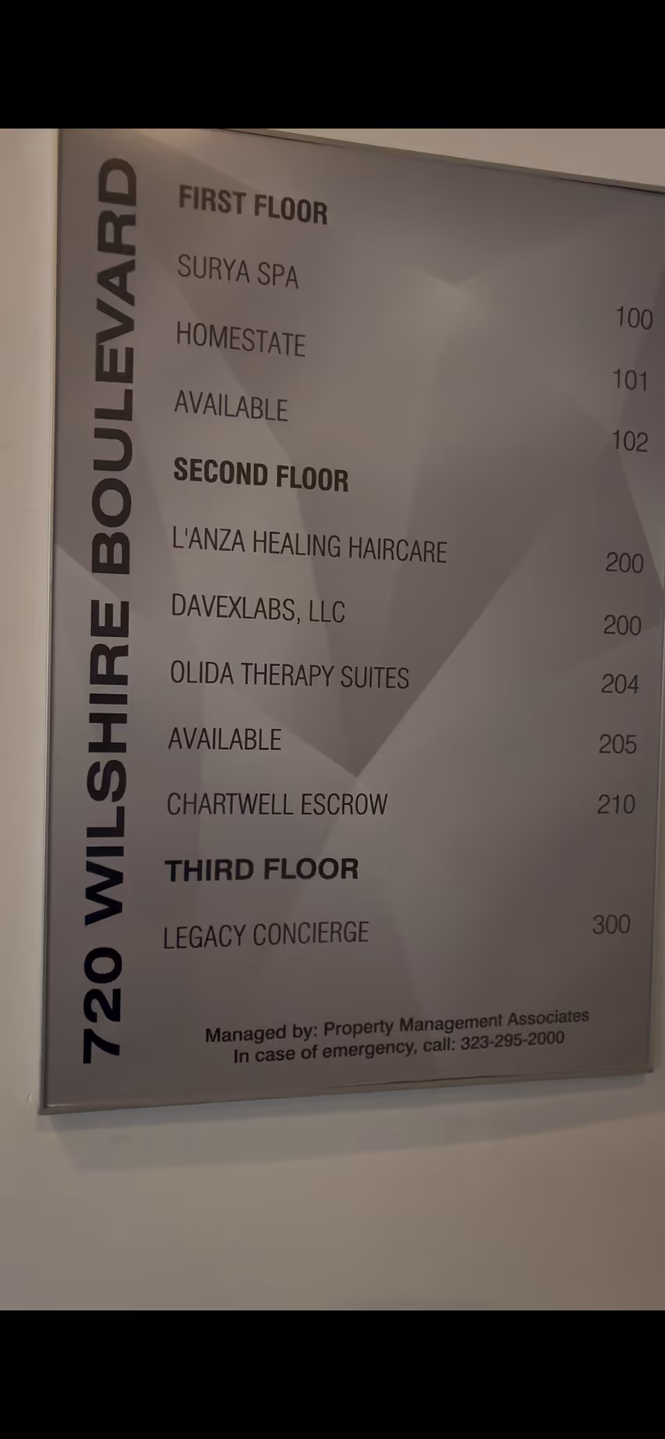 Building directory sign inside Legacy Homecare LA listing floors and tenants