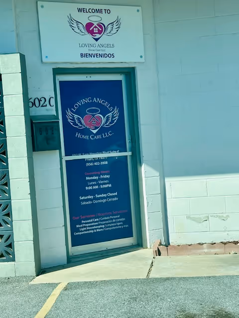 Exterior entrance of Loving Angels Home Care LLC with welcome signage and blue door