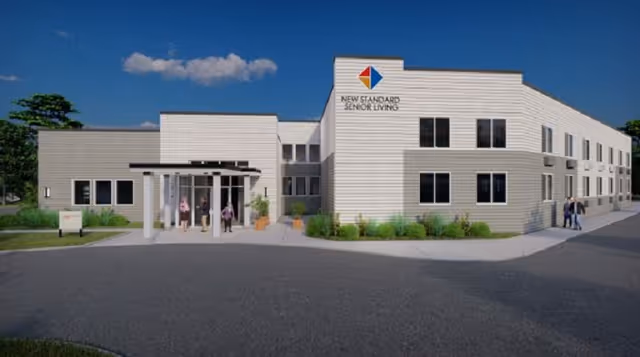 Exterior view of New Standard Senior Living at Egg Harbor Township, with entrance.