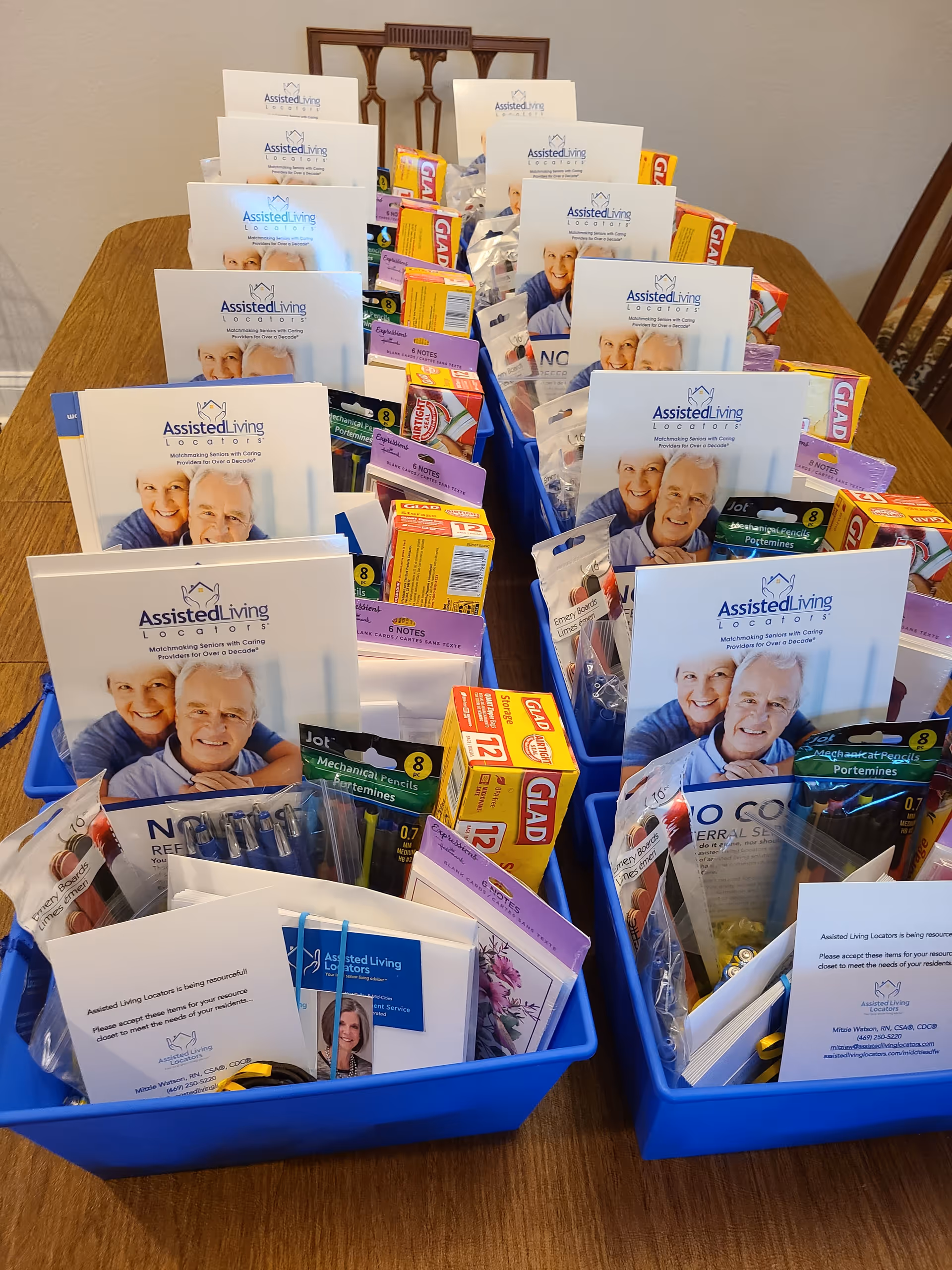 Blue trays on a wooden table filled with brochures for Assisted Living Locators.