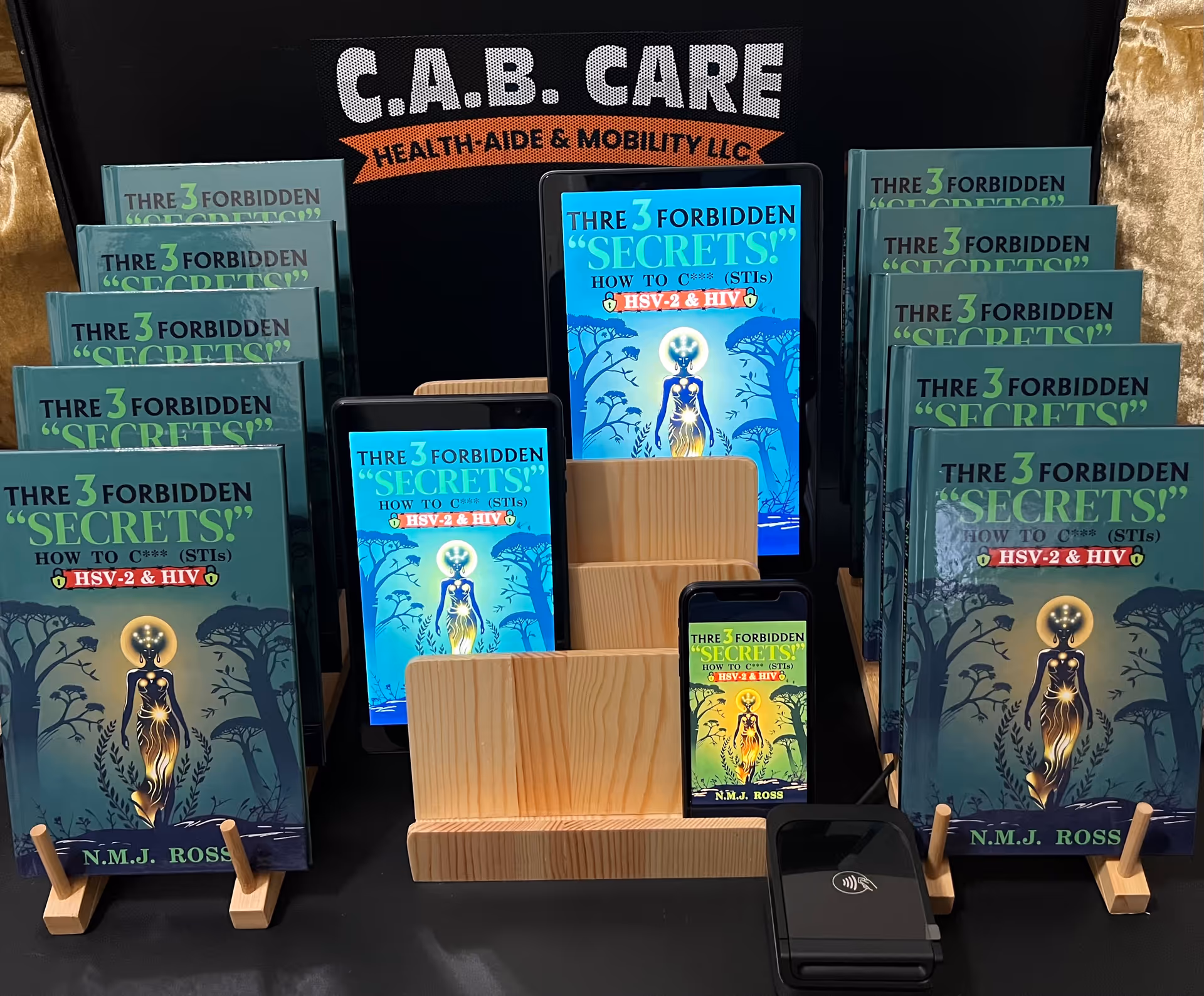 Displays numerous health brochures in front of a sign reading C.A.B. CARE Health-Aide & Mobility LLC.