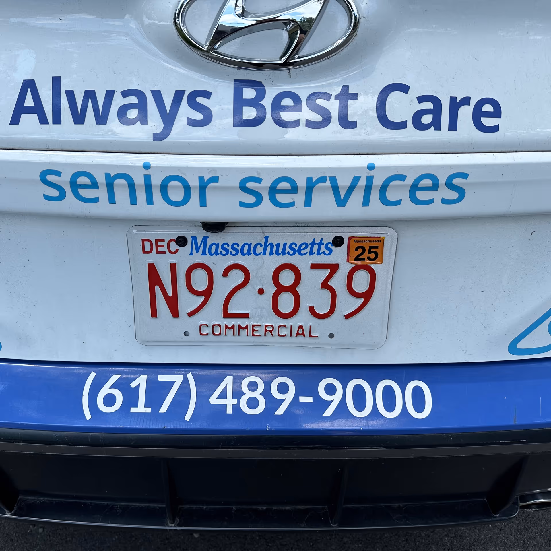 Rear view of a white van with Always Best Care senior services text and license plate