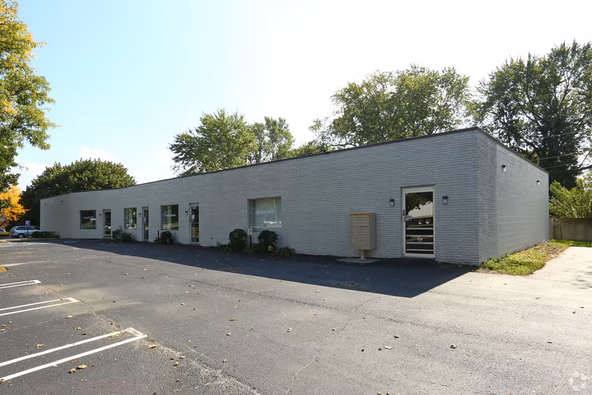 Exterior view of Superior Home Health of Michigan building with a small parking lot.