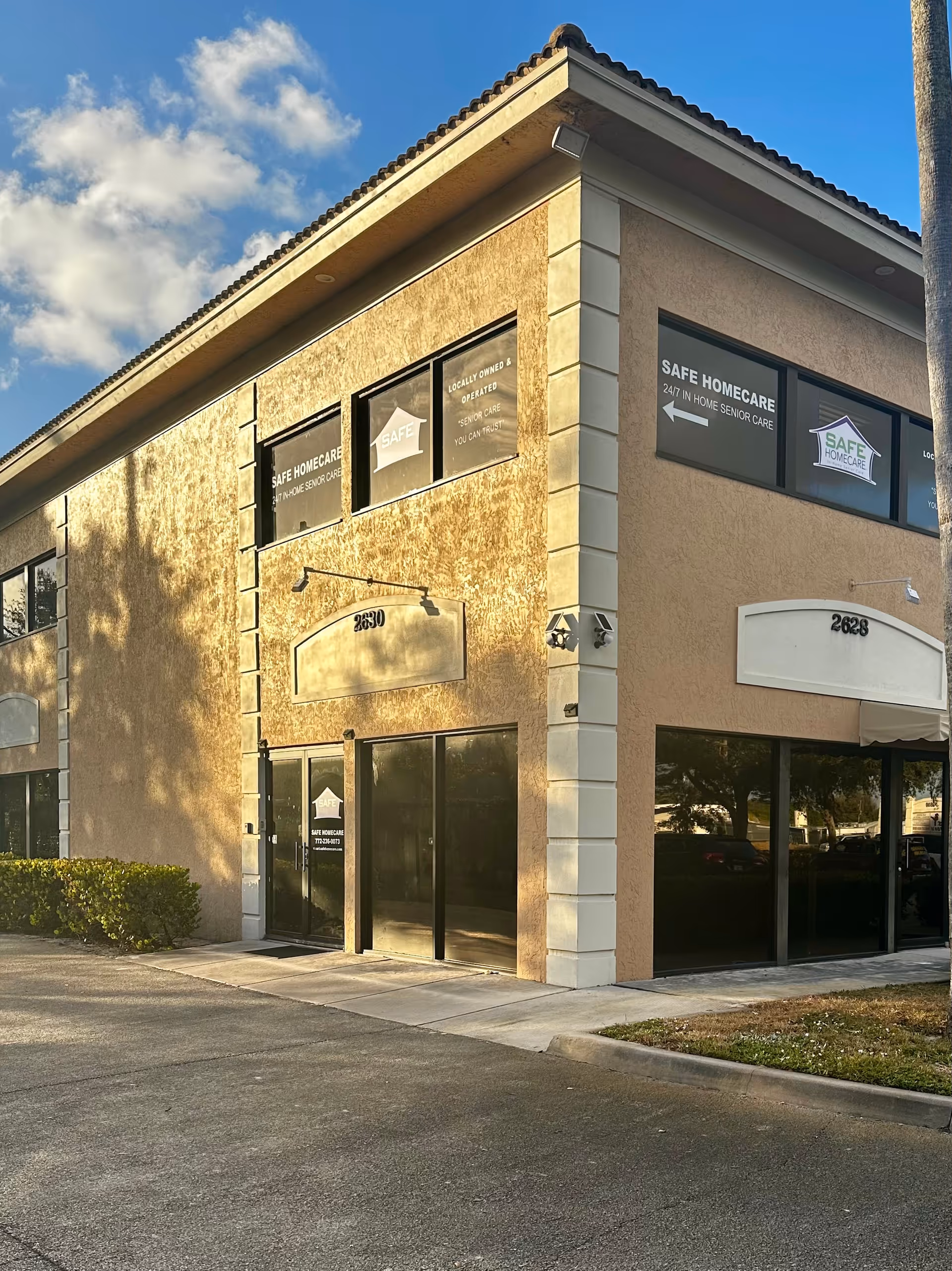 Corner exterior of Safe Homecare building featuring large storefront windows and signage.